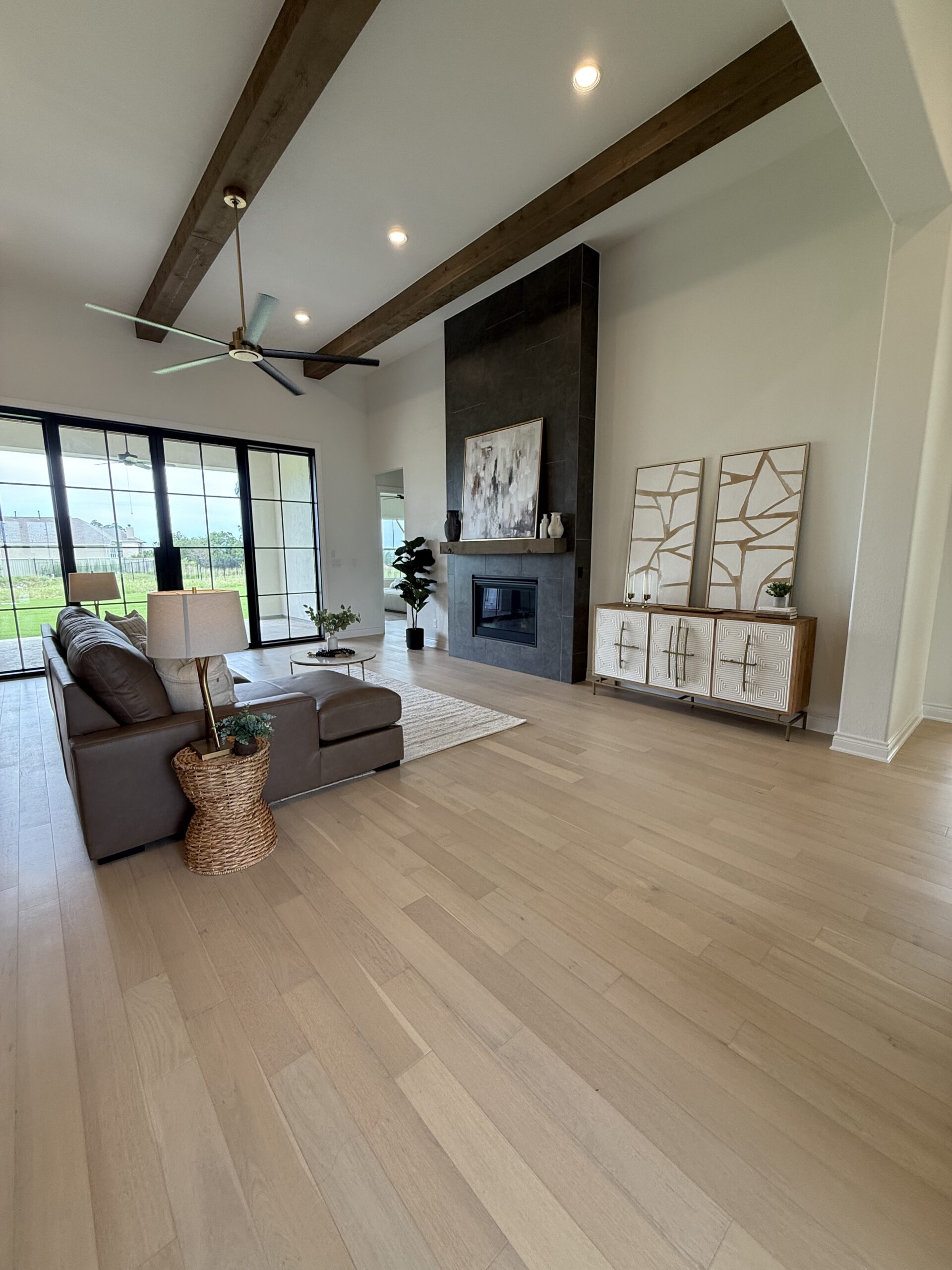Living room staging with large fireplace and windows